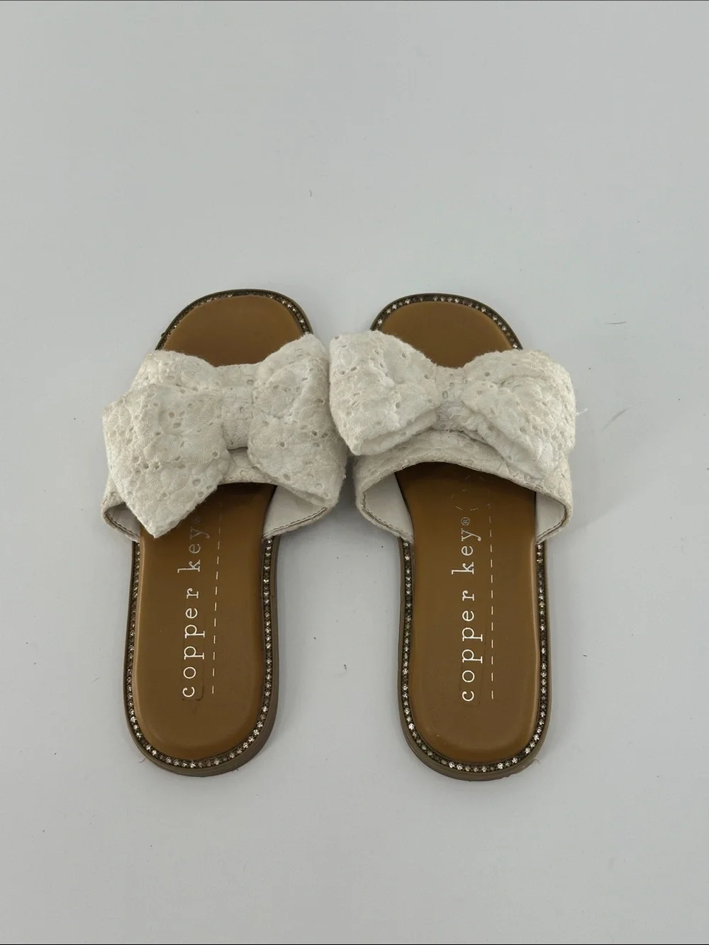 Copper Key Ivory Lace Bow Slide Sandals